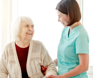 senior patient and the staff smiling