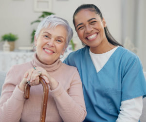 senior woman and the staff smiling