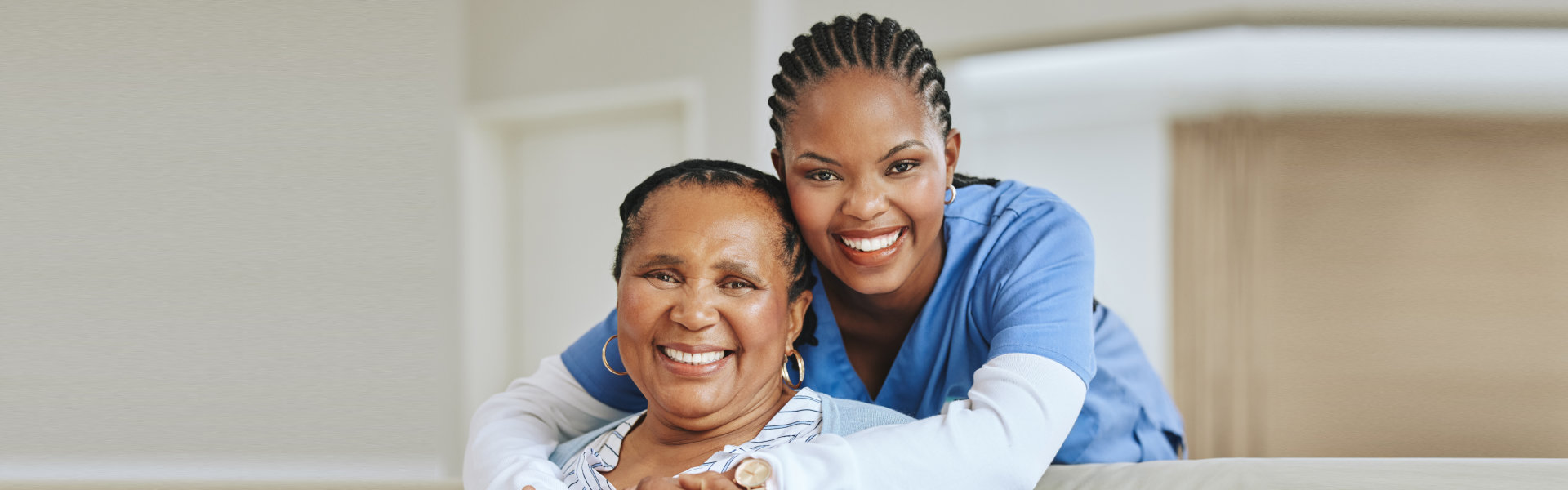 A nurse hugging a patient