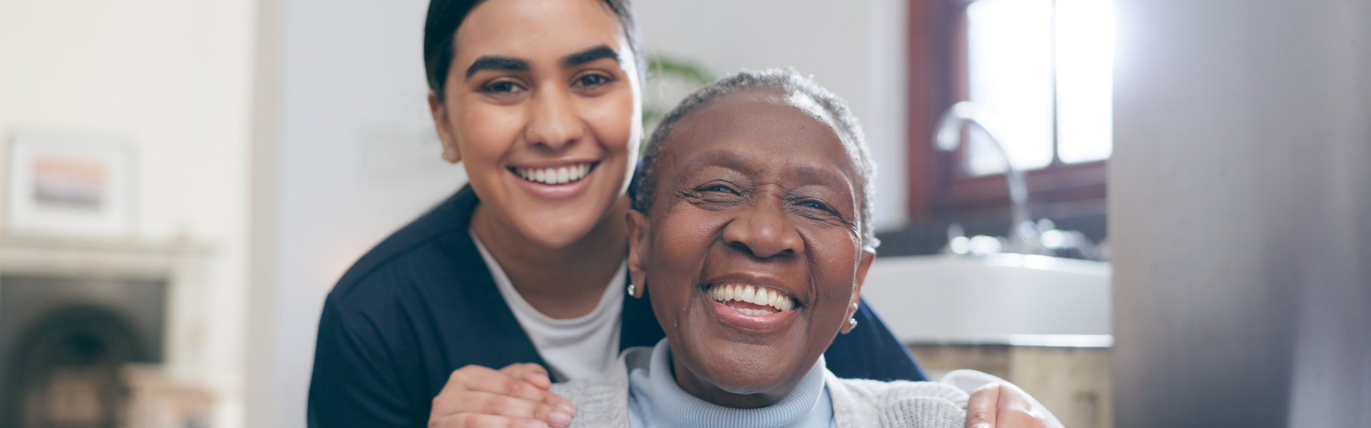 the caregiver and senior smiling