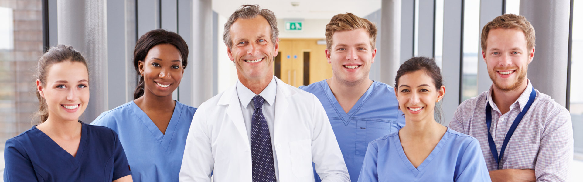 Medical Team Standing In Hospital Corridor