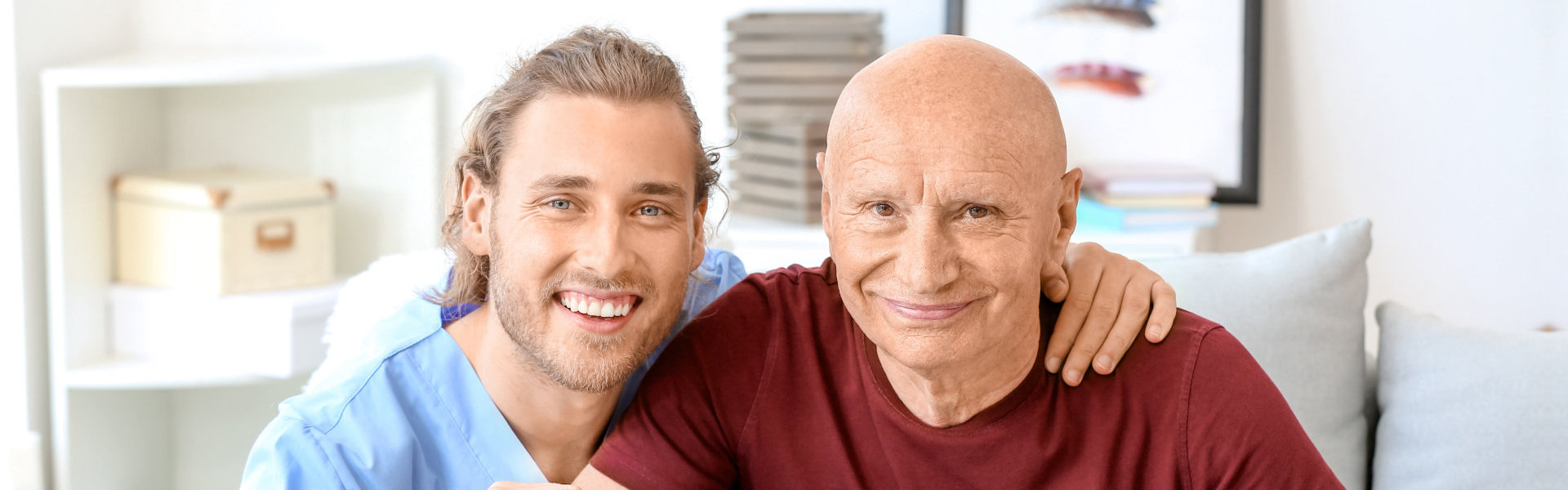 senior patient and the caregiver smiling